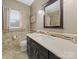 Stylish bathroom with a dark vanity, quartz countertop, and decorative backsplash at 1021 Mallard Landing Dr, Monroe, NC 28110
