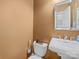 Cozy half bathroom features a pedestal sink, classic fixtures and neutral paint at 1021 Mallard Landing Dr, Monroe, NC 28110