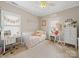 Bedroom features two windows, a daybed, a desk and a dresser at 1021 Mallard Landing Dr, Monroe, NC 28110