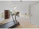 Bonus room featuring a treadmill, ironing board, neutral carpet, and ceiling fan at 1021 Mallard Landing Dr, Monroe, NC 28110