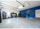 Bright two-tone garage featuring storage solutions, workout equipment, and ample space at 1021 Mallard Landing Dr, Monroe, NC 28110