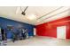 Spacious two-tone garage featuring workout equipment, lighting, and ample space at 1021 Mallard Landing Dr, Monroe, NC 28110