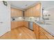 Well-lit kitchen with ample counter space, light wood cabinets, and stainless steel appliances at 1021 Mallard Landing Dr, Monroe, NC 28110