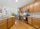 Modern kitchen with stainless steel appliances, light cabinets, and hardwood floors is stylish at 1021 Mallard Landing Dr, Monroe, NC 28110