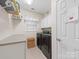 Bright laundry room features neutral tile floor, modern washer/dryer, and built-in storage at 1021 Mallard Landing Dr, Monroe, NC 28110