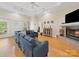 Spacious living room with hardwood floors, fireplace, and coffered ceiling exudes comfort at 1021 Mallard Landing Dr, Monroe, NC 28110
