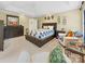 Spacious bedroom features a trey ceiling, and a large bed with built-in storage at 1021 Mallard Landing Dr, Monroe, NC 28110
