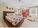 Large bedroom showcases a trey ceiling, and a dark wood bed with built-in storage at 1021 Mallard Landing Dr, Monroe, NC 28110
