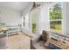 Cozy sunroom with plenty of natural light, comfortable seating, and a view of the backyard at 1021 Mallard Landing Dr, Monroe, NC 28110