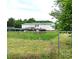 View of fenced-in backyard with patio or deck and weathered siding at 103 Amy Dr, Kings Mountain, NC 28086