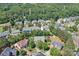 Aerial view of a residential neighborhood showcasing tree-lined streets and well-maintained homes at 10418 Goosefoot Nw Ct, Concord, NC 28027