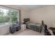 Bedroom featuring a cozy atmosphere, natural light from the window, and a simple bed frame at 10418 Goosefoot Nw Ct, Concord, NC 28027