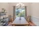 Formal dining room with ample seating, large windows, and stylish decor at 10418 Goosefoot Nw Ct, Concord, NC 28027
