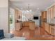 Open kitchen with stainless steel appliances and a view of the living room with a fireplace at 10418 Goosefoot Nw Ct, Concord, NC 28027