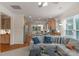 Open layout of the living room with a view of the kitchen with stainless steel appliances and granite countertops at 10418 Goosefoot Nw Ct, Concord, NC 28027