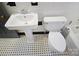 Close up of a clean bathroom with tile floors and white toilet and sink at 1101 Pee Dee Ave, Albemarle, NC 28001