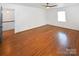 Large bedroom with hardwood floors, a ceiling fan, and natural light at 1101 Pee Dee Ave, Albemarle, NC 28001