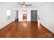 Bright bedroom with hardwood flooring and multiple doorways at 1101 Pee Dee Ave, Albemarle, NC 28001
