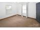 Comfortable bedroom featuring natural light from windows and neutral carpeting at 1101 Pee Dee Ave, Albemarle, NC 28001