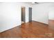 Neutral bedroom featuring hardwood floors and gray doors at 1101 Pee Dee Ave, Albemarle, NC 28001