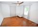 Bright bedroom featuring beautiful hardwood floors, a ceiling fan, and a white crib at 1101 Pee Dee Ave, Albemarle, NC 28001