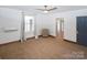 Bedroom featuring carpeted floor, a modern ceiling fan, and a window with sheer curtains at 1101 Pee Dee Ave, Albemarle, NC 28001
