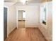 Bright bedroom featuring light wood flooring, neutral walls, and a window for natural light at 1101 Pee Dee Ave, Albemarle, NC 28001