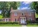 Charming brick home with a well-manicured lawn, classic architecture, and inviting front entrance at 1101 Pee Dee Ave, Albemarle, NC 28001