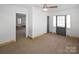 Inviting living room with neutral walls and carpet, showcasing the open layout at 1101 Pee Dee Ave, Albemarle, NC 28001