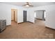 Bright living room with neutral carpet and white walls at 1101 Pee Dee Ave, Albemarle, NC 28001