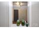 Shelved display area with planted jars and decorative pieces, enhancing the home's charm at 1101 Pee Dee Ave, Albemarle, NC 28001