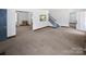 Spacious living room featuring a staircase and views into other rooms at 1101 Pee Dee Ave, Albemarle, NC 28001