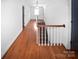 Hardwood staircase with white walls and natural light at 1101 Pee Dee Ave, Albemarle, NC 28001