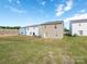 View of backyards of neighboring homes and blue sky at 11019 Daisy Ct, Charlotte, NC 28262