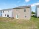 Backyard with a sliding door and freshly cut grass at 11019 Daisy Ct, Charlotte, NC 28262