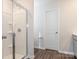 Bathroom features a glass enclosed shower, and modern fixtures at 11019 Daisy Ct, Charlotte, NC 28262
