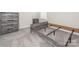 Bedroom features a modern gray wood-look bedroom set and neutral carpeting at 11019 Daisy Ct, Charlotte, NC 28262