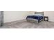 Bedroom features soft carpeting and modern grey wood bedroom furniture set with a blue comforter at 11019 Daisy Ct, Charlotte, NC 28262