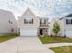 Charming two-story home with a two-car garage and a well-maintained lawn at 11019 Daisy Ct, Charlotte, NC 28262