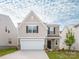 Exterior of home with attached garage, neutral siding, and manicured front lawn at 11019 Daisy Ct, Charlotte, NC 28262