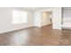 Spacious living room with hardwood floors, white walls, and lots of natural light at 11019 Daisy Ct, Charlotte, NC 28262