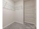 Walk-in closet features soft carpeting and wire shelving at 11019 Daisy Ct, Charlotte, NC 28262