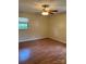 Bedroom with hardwood floors, window and ceiling fan at 1120 Mcintyre Rd, Wingate, NC 28174