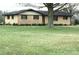 Single story home with brick and siding exterior, dark shutters, and a large front yard at 1120 Mcintyre Rd, Wingate, NC 28174