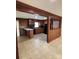 Eat-in kitchen featuring wood-paneled walls, tile floor and black appliances at 1120 Mcintyre Rd, Wingate, NC 28174