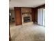 Tile floor living room with brick fireplace and access to the outdoors at 1120 Mcintyre Rd, Wingate, NC 28174