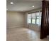 Bright living room featuring neutral walls, tile flooring and a large window at 1120 Mcintyre Rd, Wingate, NC 28174