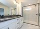 New bathroom featuring double vanity, quartz countertop, and glass enclosed tile shower at 11455 Prosperity Church Rd, Huntersville, NC 28078