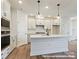 Open floor plan with new kitchen featuring quartz countertops, island, and modern appliances at 11455 Prosperity Church Rd, Huntersville, NC 28078