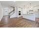 Open floor plan with new kitchen featuring quartz countertops, island, and modern appliances at 11455 Prosperity Church Rd, Huntersville, NC 28078